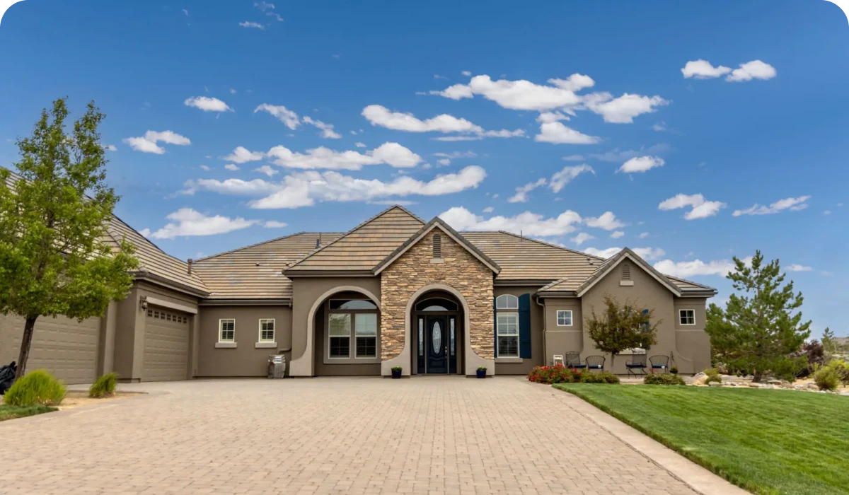Modern suburban house with a spacious driveway.