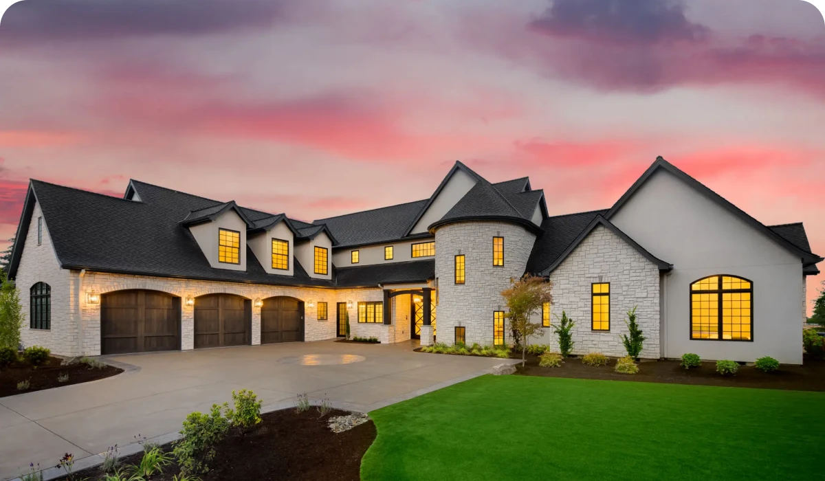 Large house with sunset sky background.